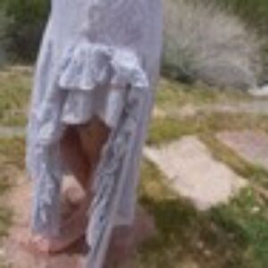 Long flowing asymmetrical skirt with ruffles in white and black geometric print